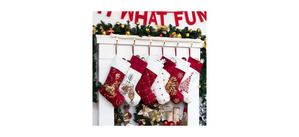 3 red Christmas stockings and 3 white Christmas stockings hanging up 3 red Christmas stockings and 3 white Christmas stockings hanging up