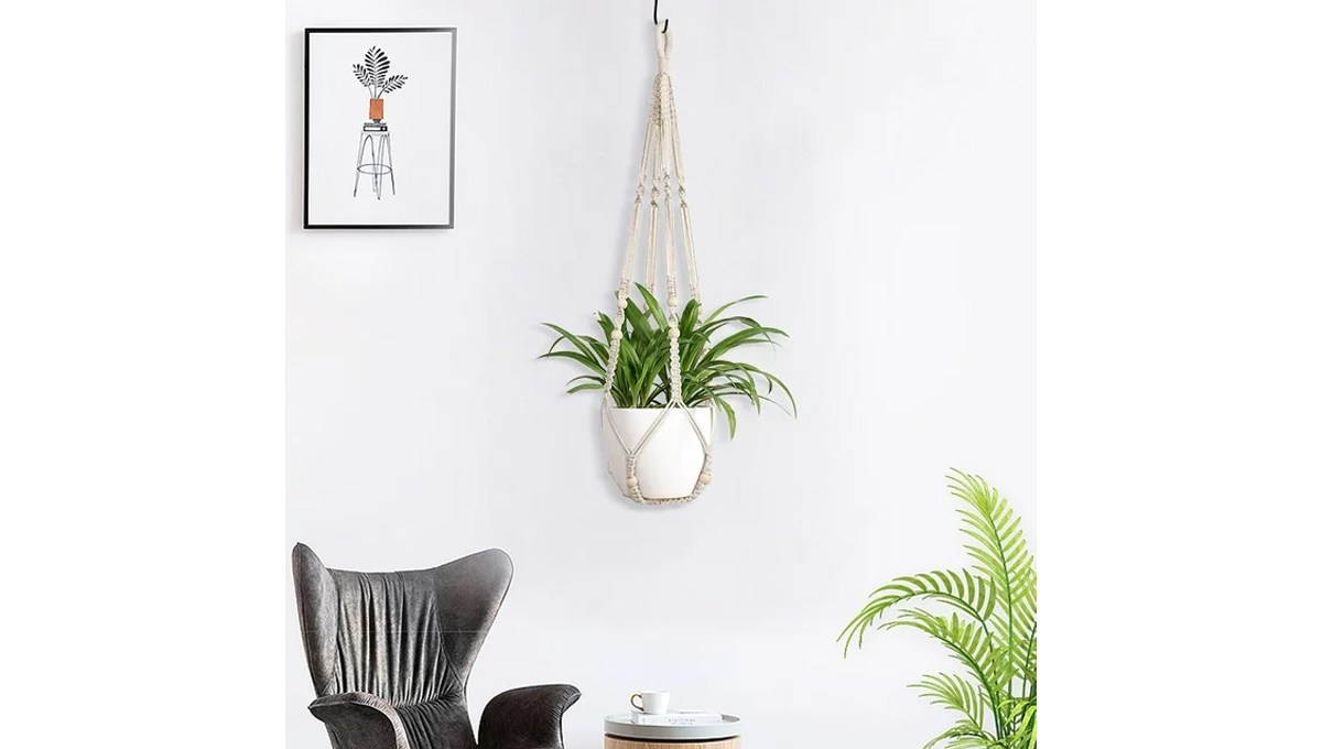 The AUQ Europe Plant Hanger hanging in a room with a chair, side table, wall art and a plant. The AUQ Europe Plant Hanger hanging in a room with a chair, side table, wall art and a plant.