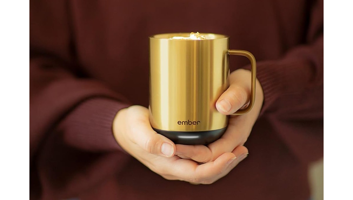 A closeup of hands holding an Ember Temperature Control Smart Mug 2. A closeup of hands holding an Ember Temperature Control Smart Mug 2.