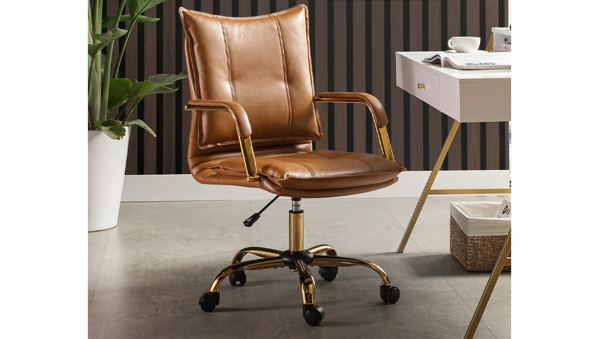 A tan leather chair in an office. A tan leather chair in an office.