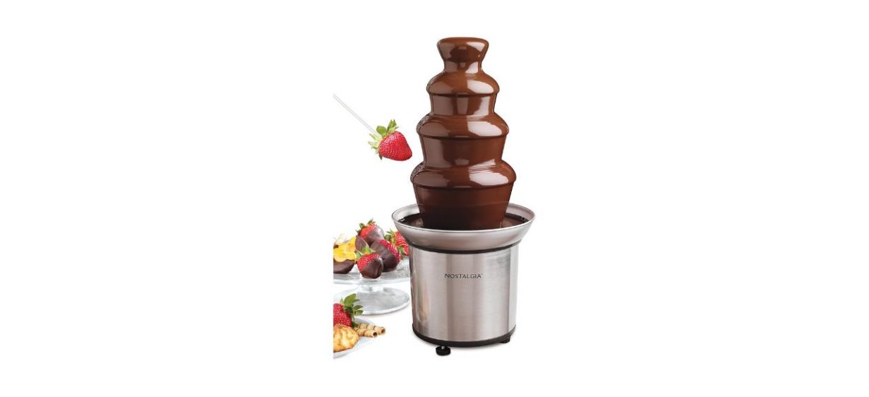 Chocolate fountain machine with chocolate and fruits Chocolate fountain machine with chocolate and fruits