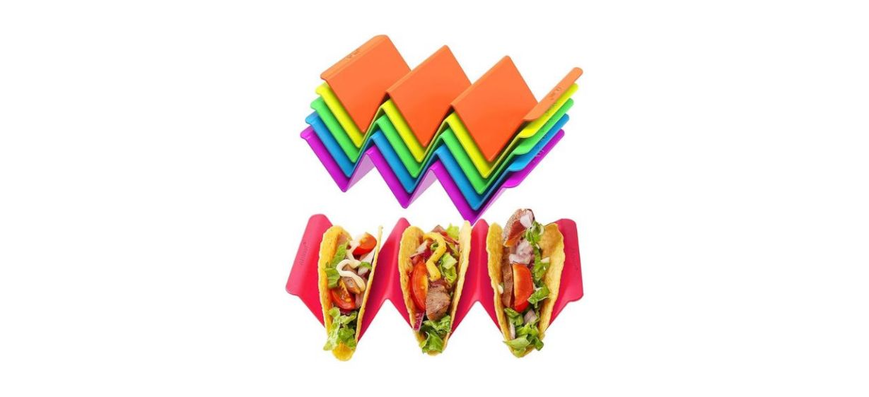 Six colorful taco holders with three tacos Six colorful taco holders with three tacos