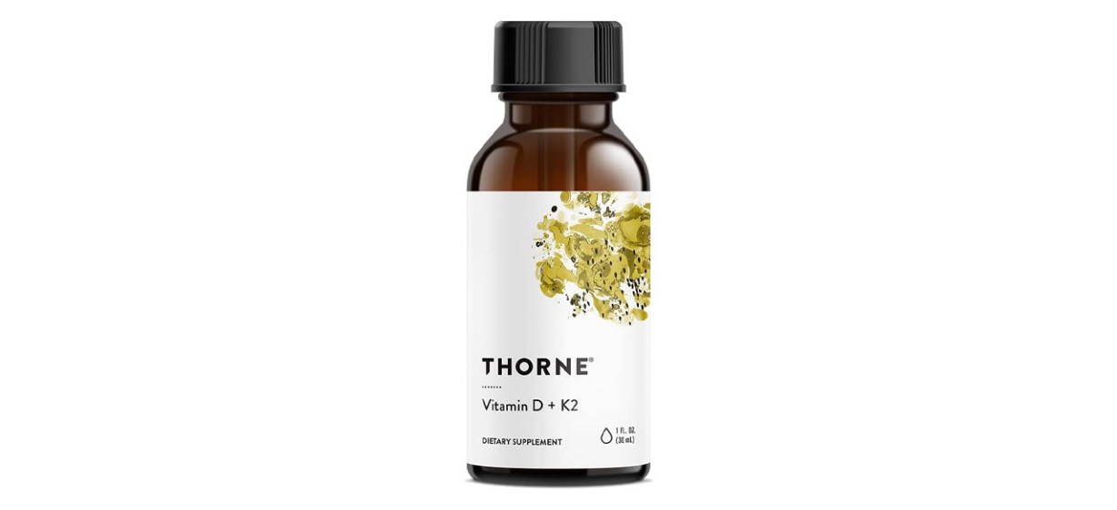 Bottle of Thorne Vitamin D and K2 Liquid on white background Bottle of Thorne Vitamin D and K2 Liquid on white background